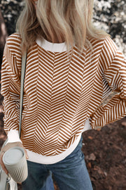 Chevron knit crewneck sweater in camel and white with a ribbed neckline and cuffs.