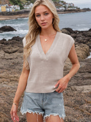 Luxe knit sleeveless v-neck sweater in Dust Storm, styled with denim shorts.