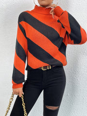 Orange-red and black diagonal stripe turtleneck knit sweater with long sleeves.