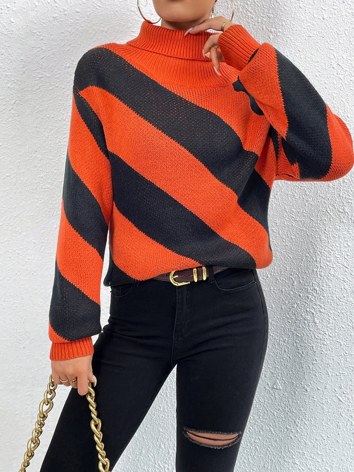Orange-red and black diagonal stripe turtleneck knit sweater with long sleeves.