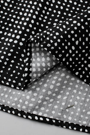 Black micro-dot puff sleeve blouse with a casual, basic style.