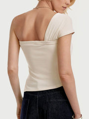 Beige asymmetrical t-shirt with knot detail and short sleeves.