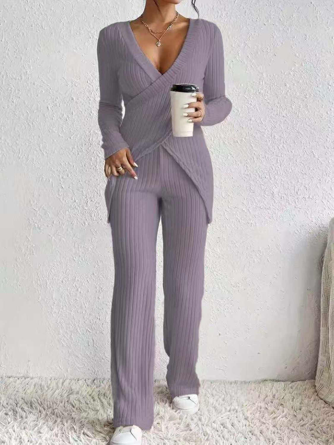 Lilac ribbed knit crossover lounge set with V-neck top and wide-leg pants.