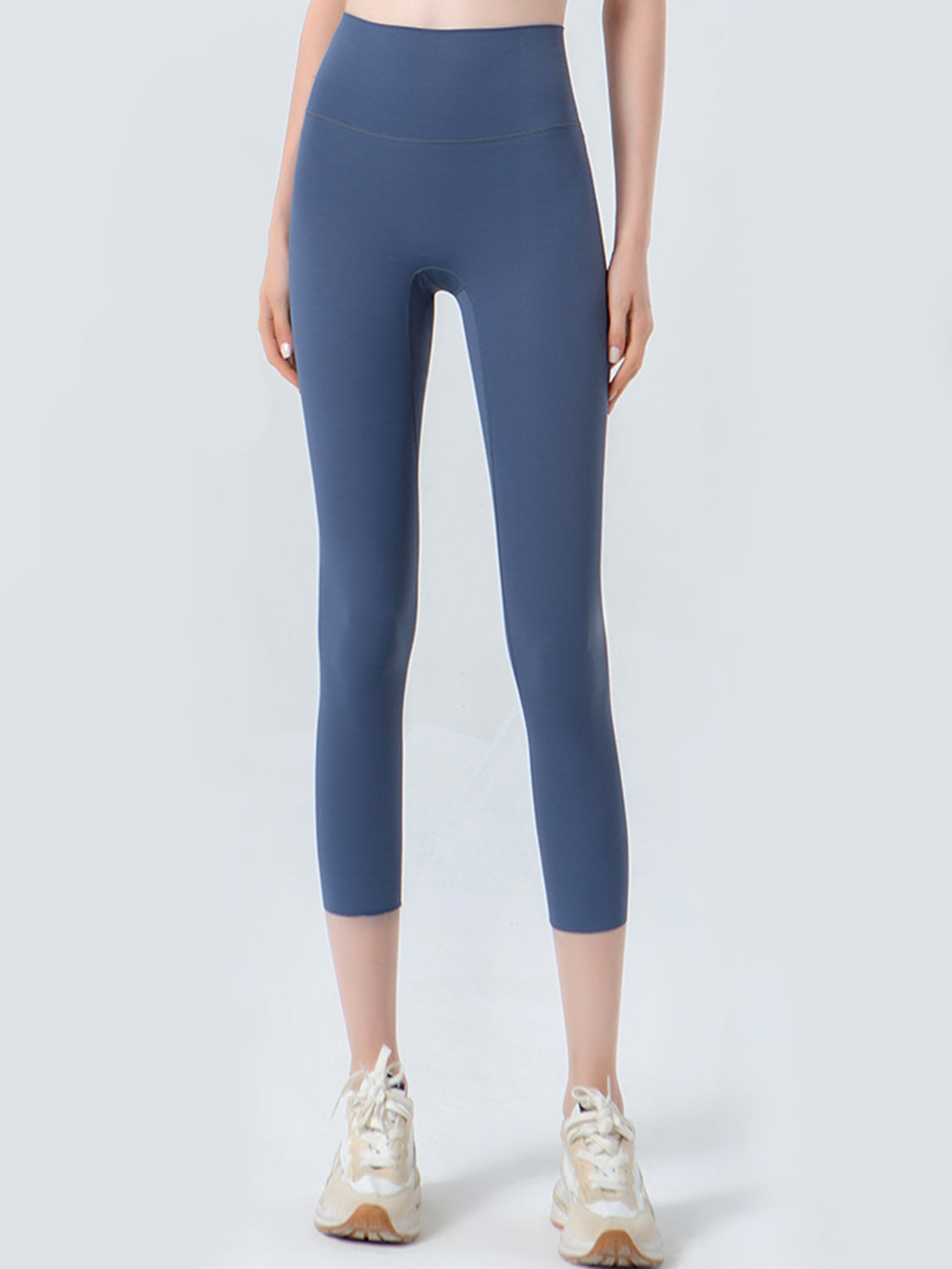 Dusty blue cropped leggings with a high waistband and mesh detail.