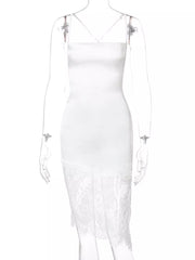White satin slip dress with lace trim hem and cowl neck.