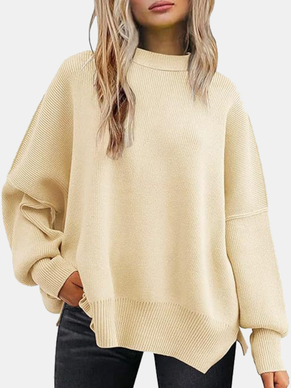 Apricot ribbed knit sweater with slouchy sleeves and mock neck.
