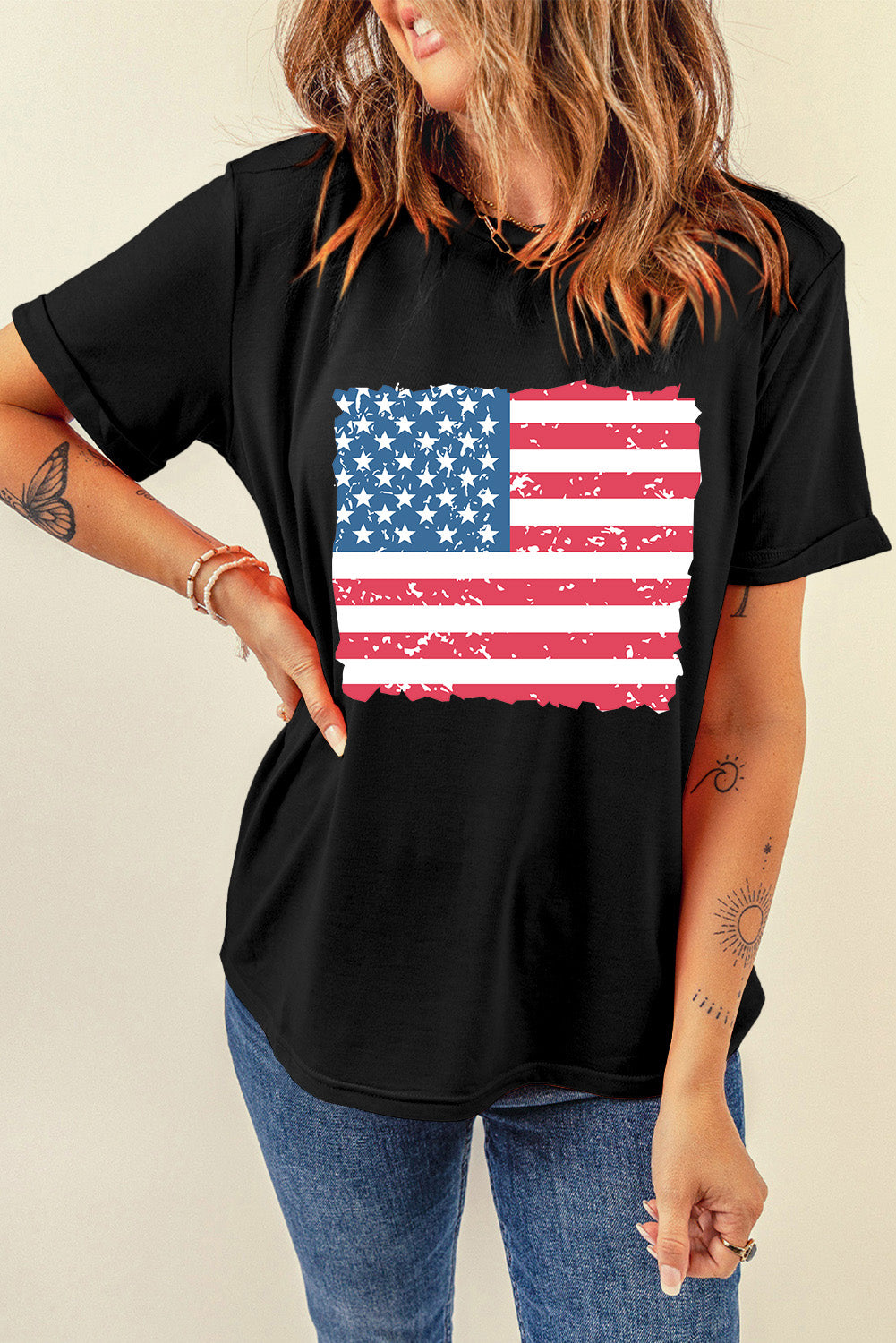 Black cotton t-shirt with a distressed American flag graphic and torn edges.