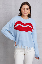 Light blue acrylic knit sweater with red kiss graphic and distressed hem.