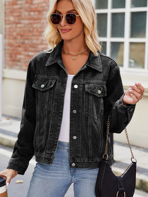 Black faded denim boxy fit jacket with button closures and chest pockets.