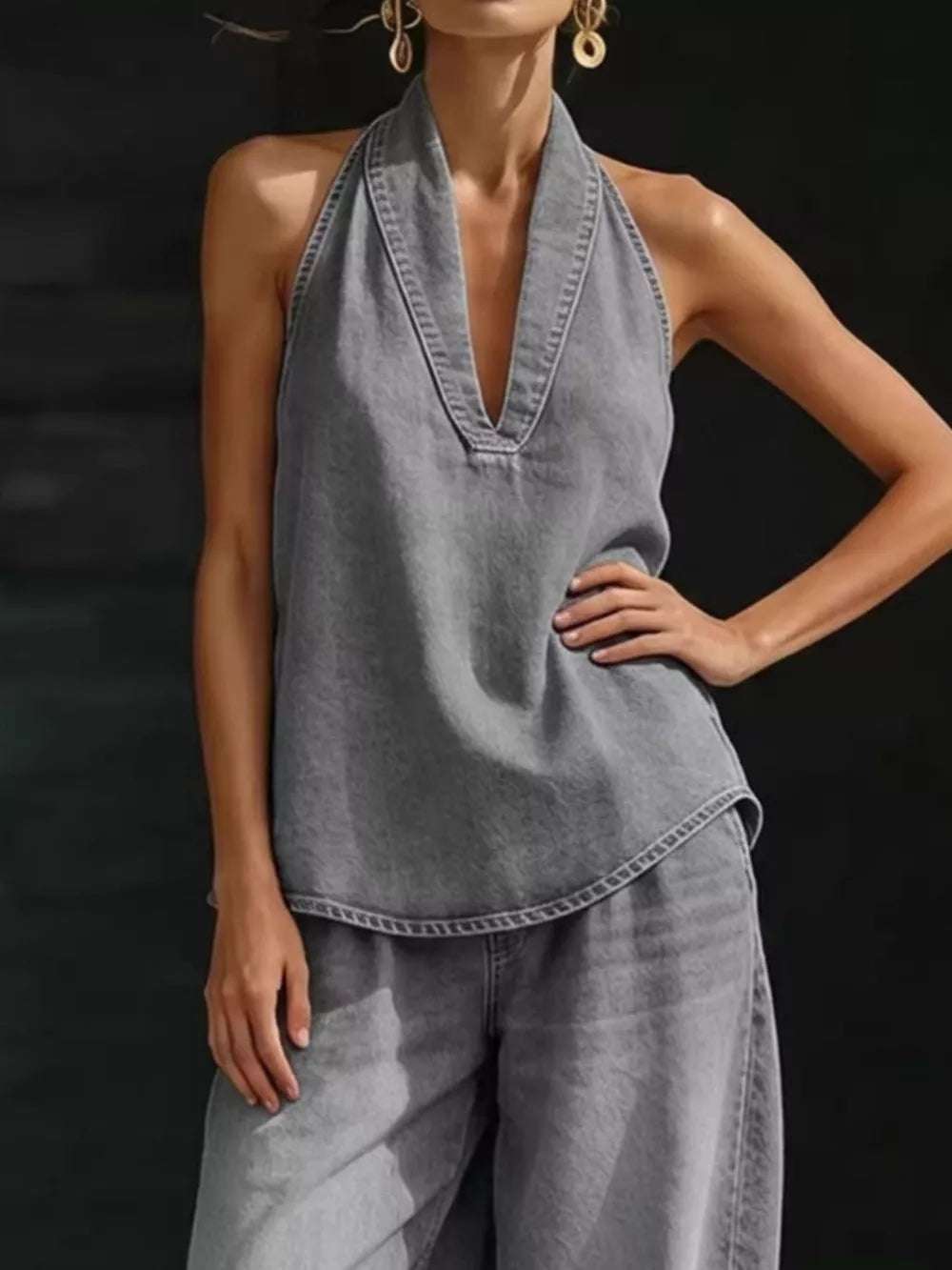 Gray denim halter neck top with deep V-neck and matching wide-leg pants.