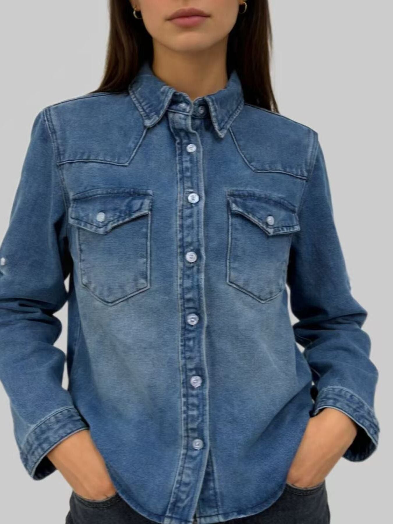 Classic blue denim overshirt with button-down front and chest pockets.