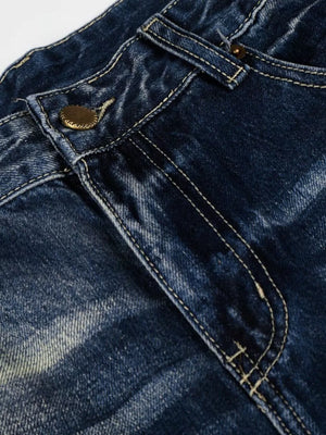 Men's distressed blue wide-leg bootcut jeans with button closure detail.