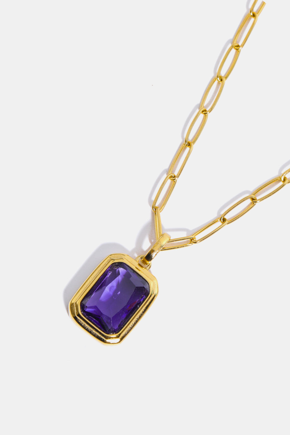 Gilded Prism Pendant Necklace with purple gem and gold paperclip chain.