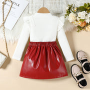 Baby girls' red faux leather a-line skirt and white ribbed ruffled top set.