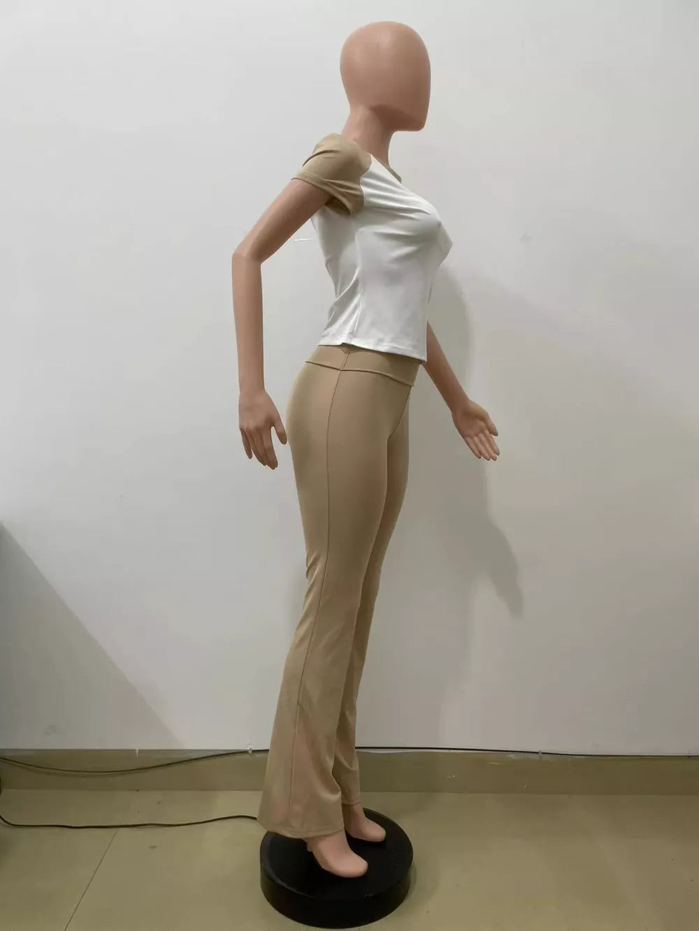 Chic contrast tee and pants set in camel and white, body-hugging casual outfit.