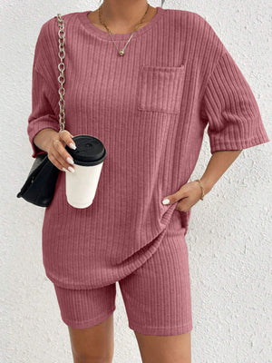 Relaxed ribbed lounge set in Dusty Pink with crew neck top and shorts, featuring a chest pocket.