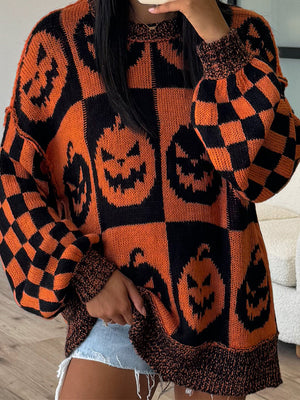 Checkerboard pumpkin knit sweater with balloon sleeves and crew neck in ochre.