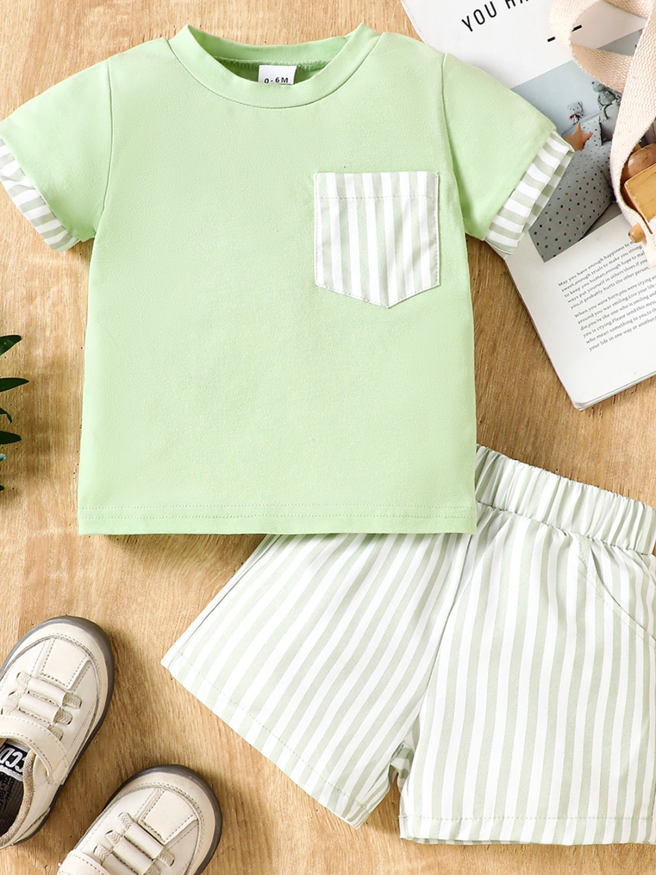 Light green cotton baby set with striped pocket tee and shorts