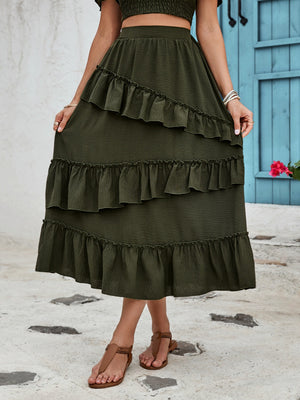 Tiered midi skirt in dark green with ruffled tiers and textured fabric.