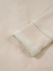 Lined western jacket in eggshell with sherpa trim on the cuff and a subtle gold stitch detail.