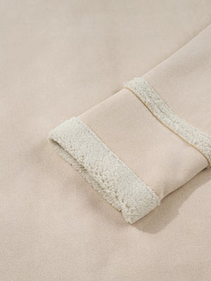 Lined western jacket in eggshell with sherpa trim on the cuff and a subtle gold stitch detail.