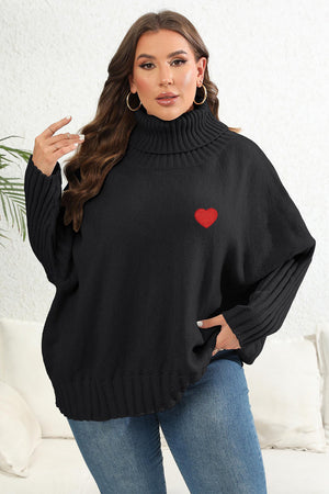 Black turtleneck knit sweater with batwing sleeves and red heart appliqué