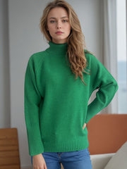 Dark green sparkly ribbed turtleneck sweater with a relaxed fit.