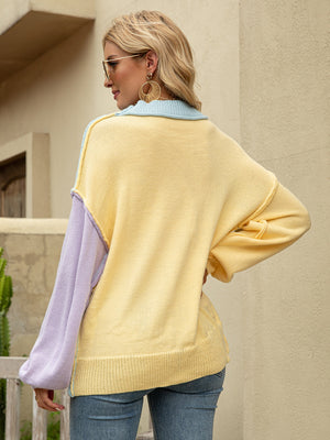 Colorblock drop shoulder knit sweater in yellow, light blue, and lavender acrylic.