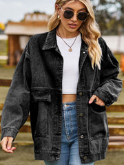 Oversized dark gray denim trucker jacket with collared neck and chest pockets.