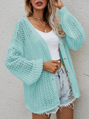 Open-knit button-down cardigan in turquoise with balloon sleeves and a relaxed fit.