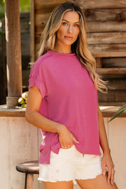 Textured ribbed tee in hot pink with rolled sleeves and a relaxed fit.