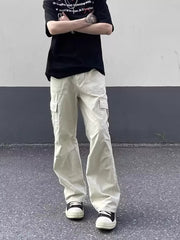 Men's relaxed fit beige cotton cargo pants with multiple pockets.