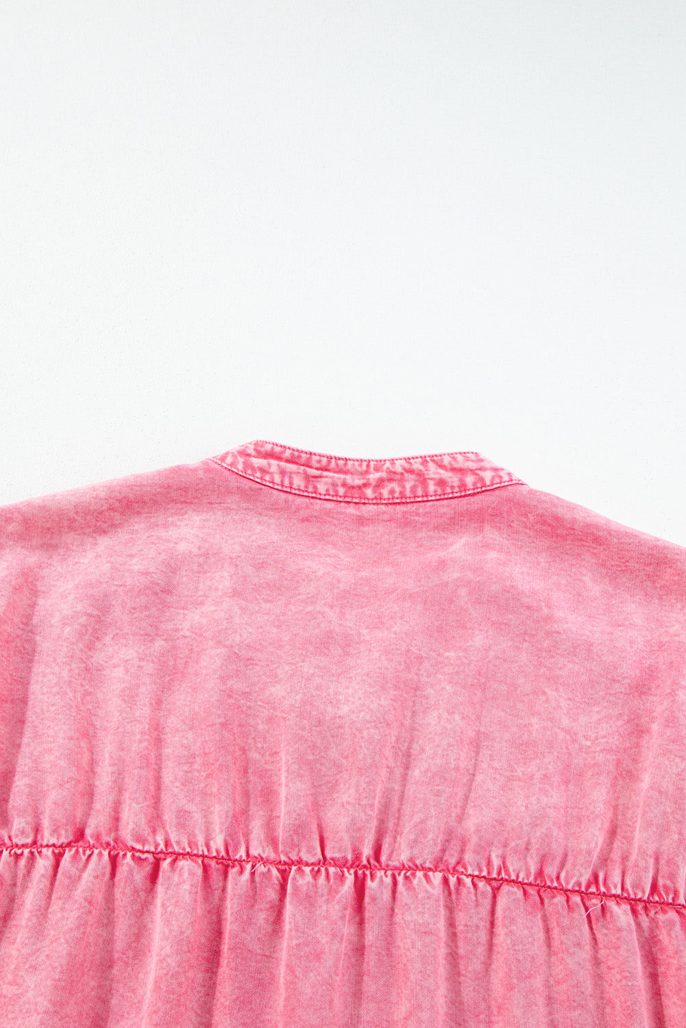 Acid wash ruffle shirt dress in dusty pink with a buttoned collar detail.