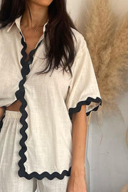 Beige linen shirt and pant set with black scalloped trim detail