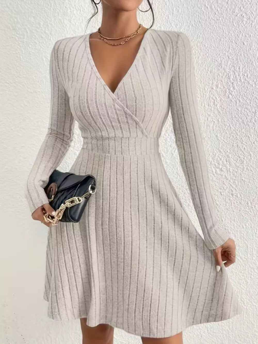 Light Gray ribbed wrap mini dress with long sleeves and V-neck.