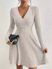Light Gray ribbed wrap mini dress with long sleeves and V-neck.