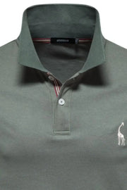 Moss piqué polo shirt with giraffe embroidery and striped collar detail.