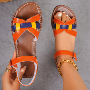 Orange woven strap buckle sandals with blue and yellow accents.