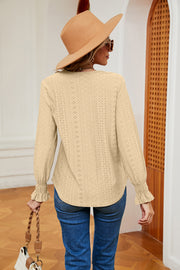 Pastel yellow eyelet blouse with lace trim and ruffle cuffs.