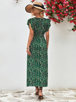 Green floral wrap midi dress with flutter sleeves and belted waist.