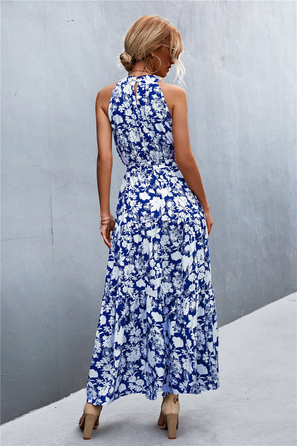 Blue floral halter neck maxi dress with tiered skirt
