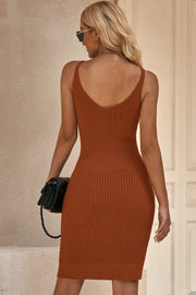 Ochre ribbed knit slip dress with V-neck and fitted silhouette.