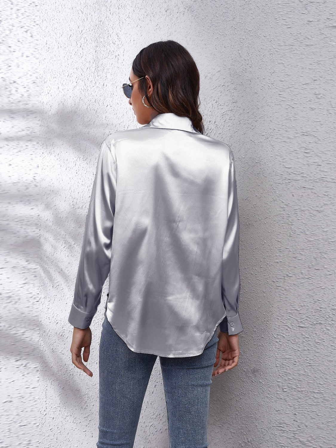 Satin button-up shirt in silver with a relaxed fit and button cuffs.