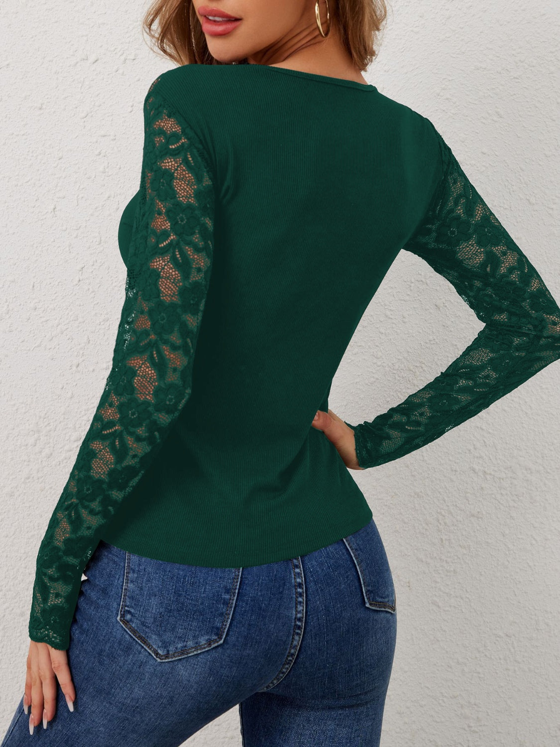 Dark green ribbed top with scalloped lace long sleeves and a crew neck.