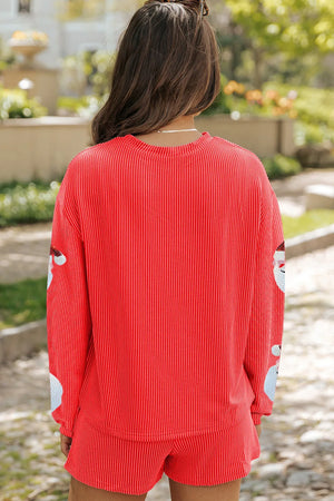 Red sequin Santa pleated co-ord set with ribbed texture and crew neck.