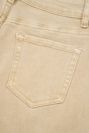 Beige denim jeans with a visible back pocket detail and contrast stitching.
