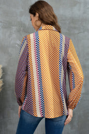 Blouse with geometric print, blouson sleeves, and a collared neckline in orange and blue.