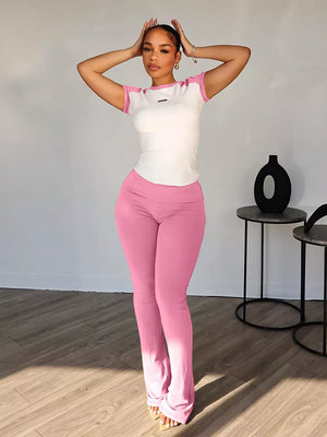 Pink and white contrast tee and pants set with a body-hugging fit.