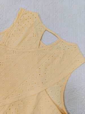 Yellow openwork knit tank top with crisscross detail and crew neck.