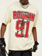 Vintage graphic t-shirt in pastel yellow with Dennis Rodman illustration and text.